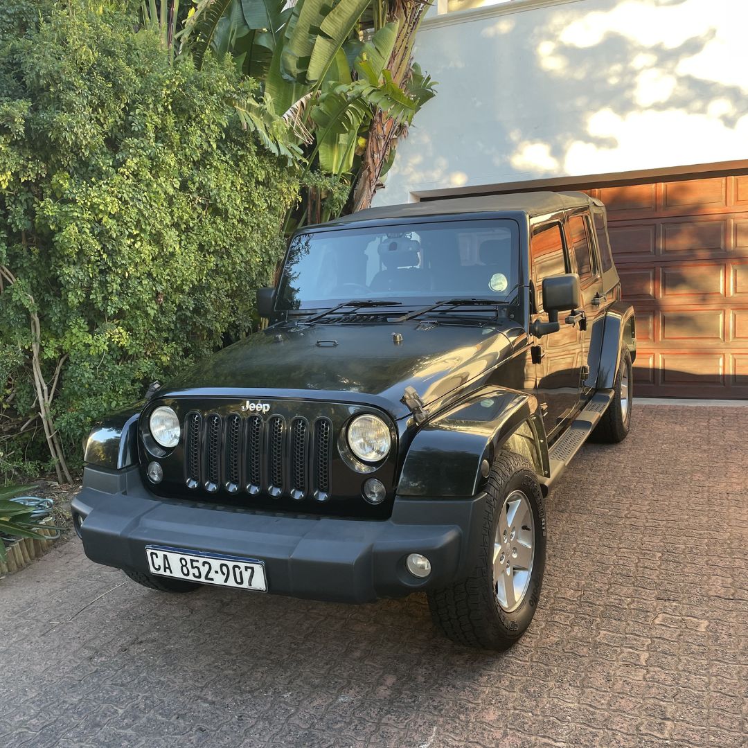 Allan's 2014 Jeep Wrangler JKU Sahara  - stock with soft top
